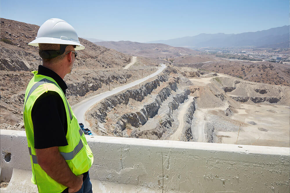 man looking over quarry